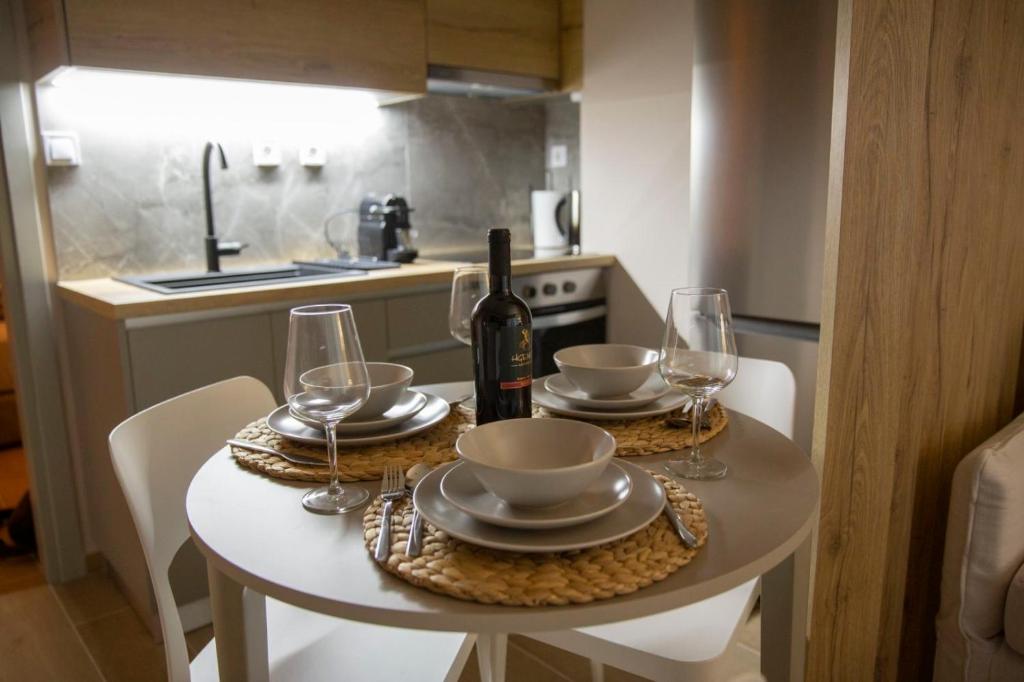 Dining table set for guests at Nerissa seafront apartment